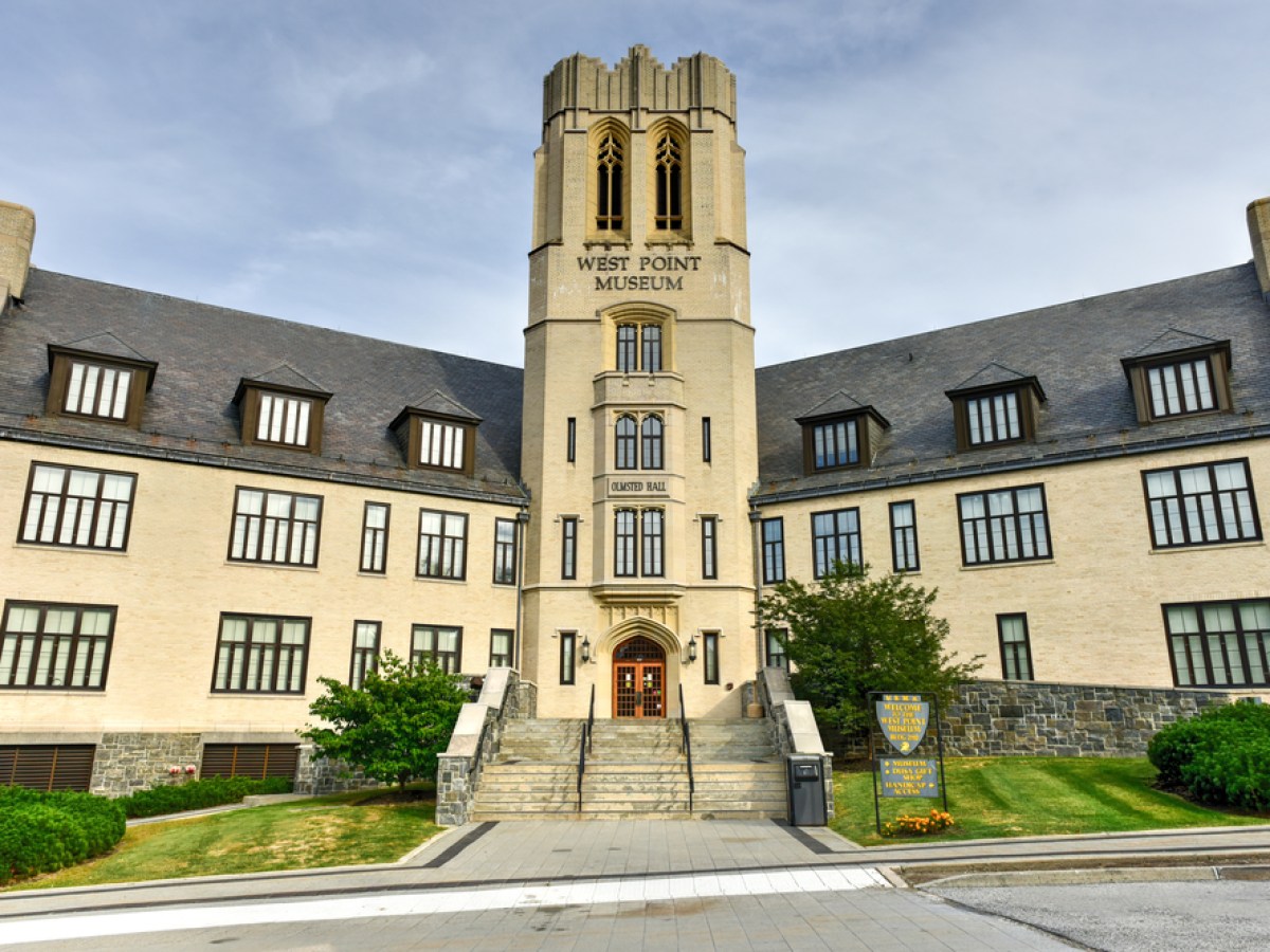 a castle with a clock on the side of a building